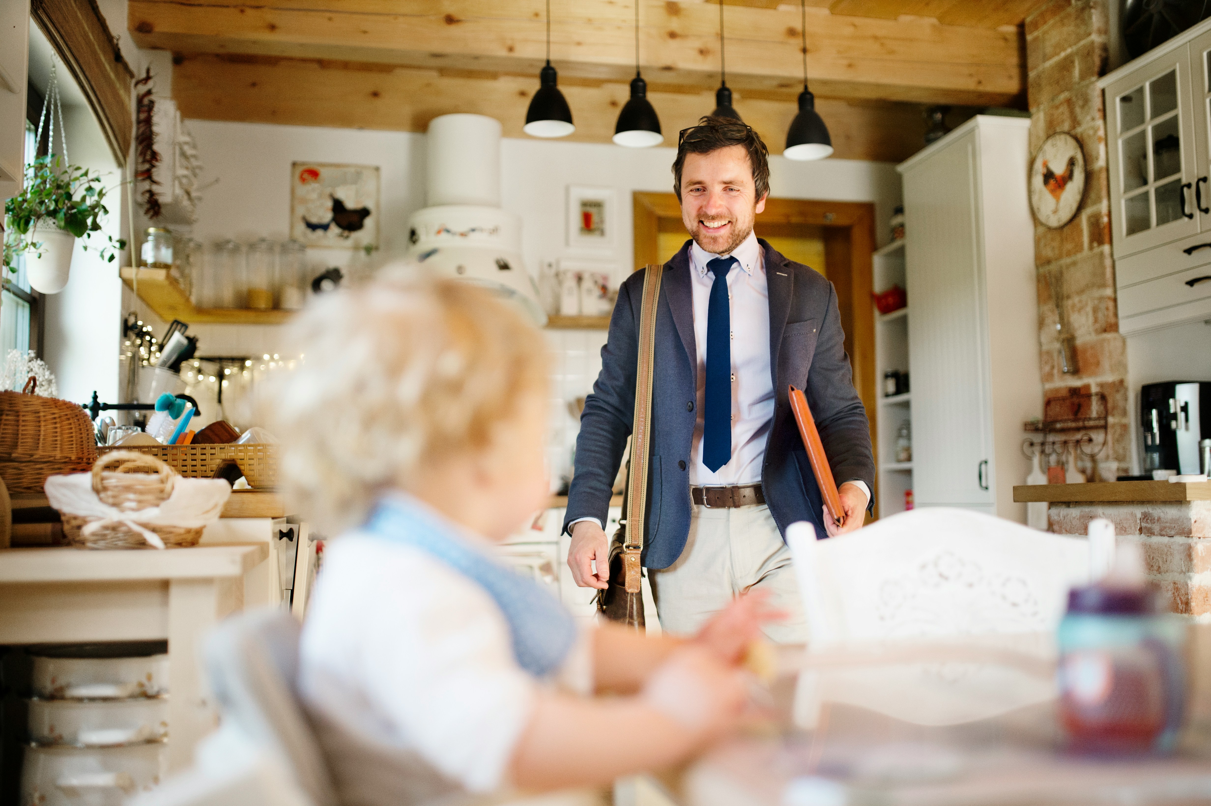 Father greeting his child after work