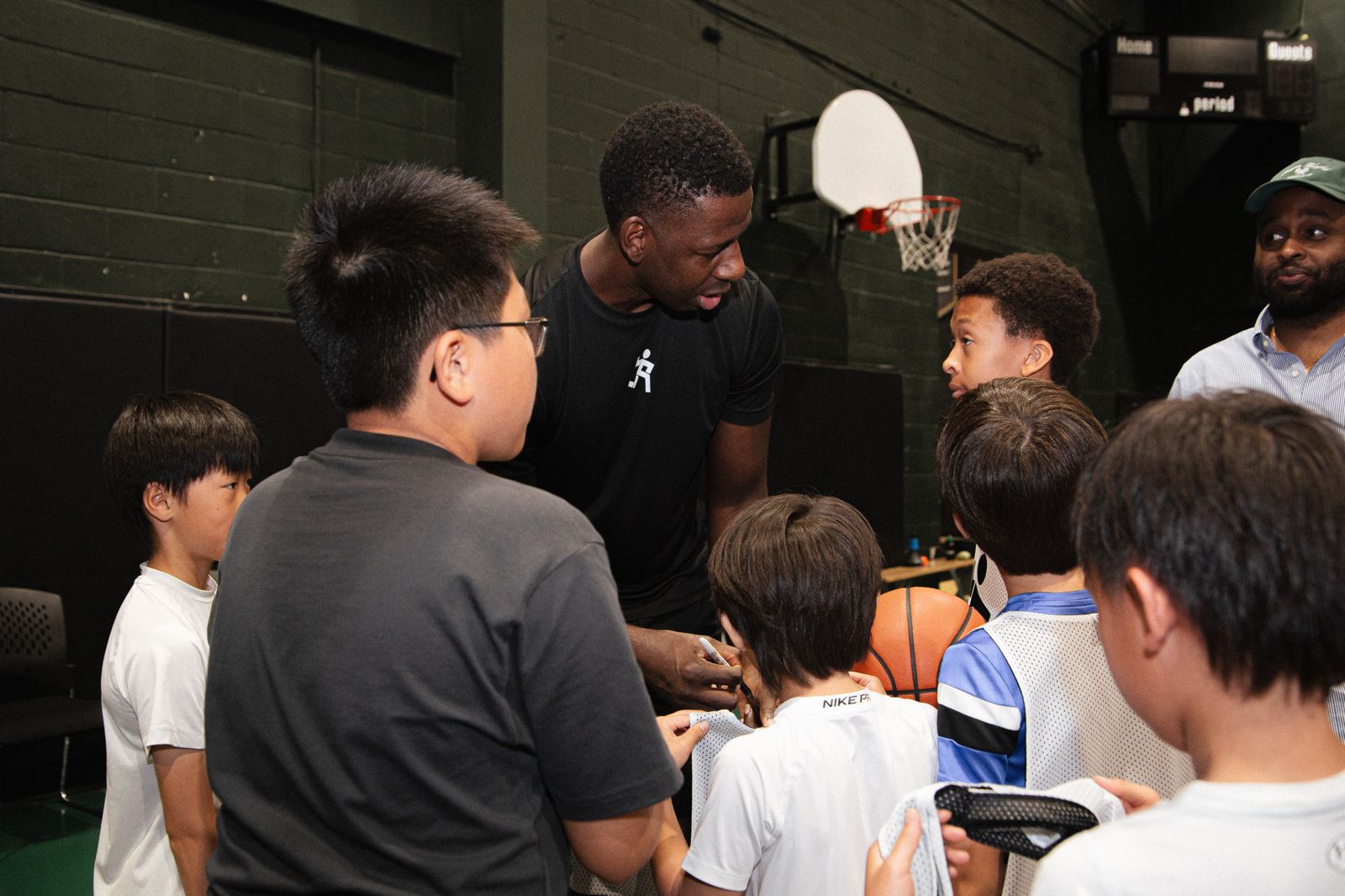 Andrew Nicholson with youth at a 44 Hoops basketball camp